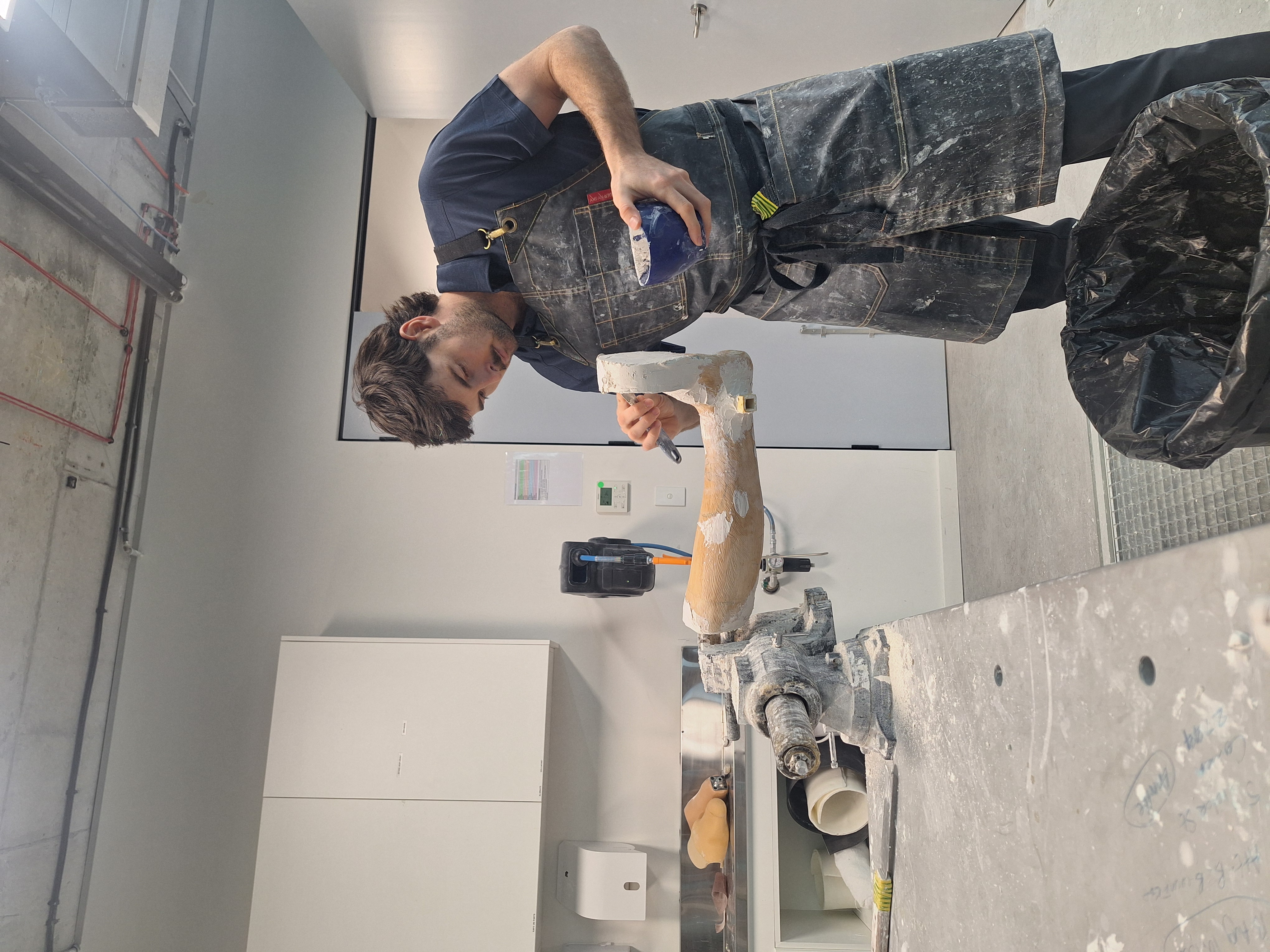 Daniel working on an AFO cast while on placement in Australia.